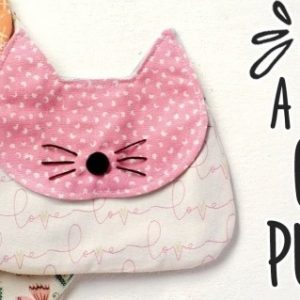 Выкройка компактной тканевой сумки с дизайном в виде головы кошки.